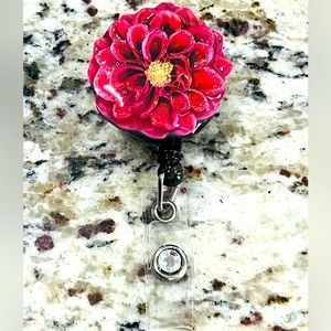 Flower badge reel. Badge pull.